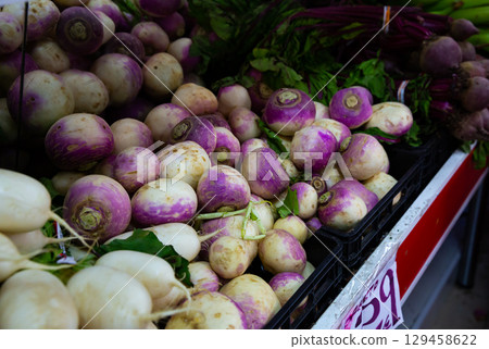 White radishes and purple turnips in greengrocery White radishes and purple turnips in greengrocery 129458622