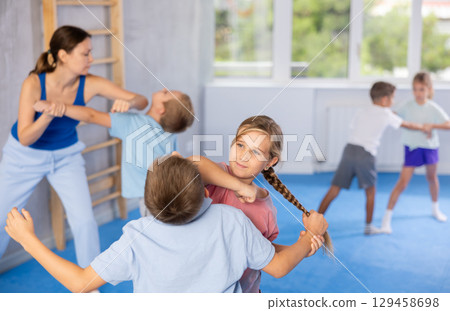 Young martial artists are practicing 129458698