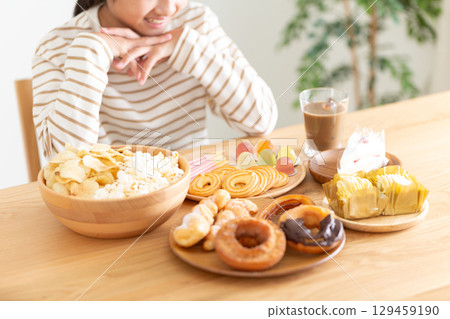 A middle school girl is happy to see all the sweets A middle school girl is happy to see all the sweets 129459190