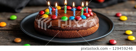 Celebrate Birthday With Chocolate Cake, Candles and Colorful Candies Decorate Cake 129459246