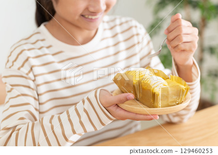 A middle school girl eating Mont Blanc cake in her room A middle school girl eating Mont Blanc cake in her room 129460253