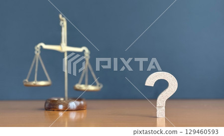 Three-dimensional question mark right and balance_black background 129460593