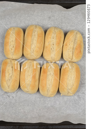 Baked oval-shaped rolls 129460873