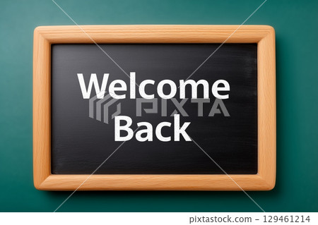 A wooden-framed chalkboard with the message "Welcome Back" written in white chalk. 129461214