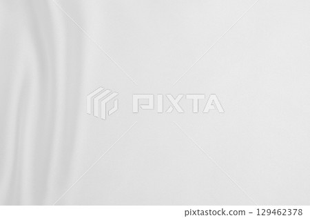 Smooth elegant white silk or satin luxury cloth texture as wedding background. Luxurious background design Smooth elegant white silk or satin luxury cloth texture as wedding background. Luxurious background design 129462378