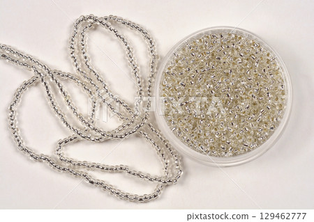 Tiny silver seed beads 129462777