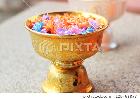 Colorful of Ribbon flowers on gold Tray for Ordination ceremony in buddhist Thai monk. Colorful of Ribbon flowers on gold Tray for Ordination ceremony in buddhist Thai monk. 129462858