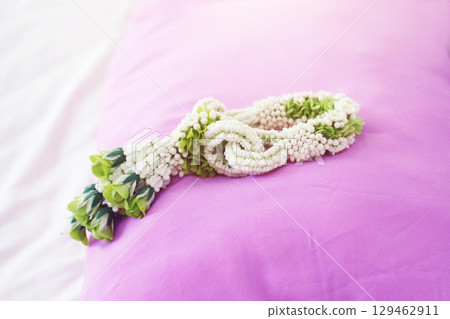 Flower garlands on pink pillow in tradition Thai wedding ceremony day. Jasmine garland 129462911