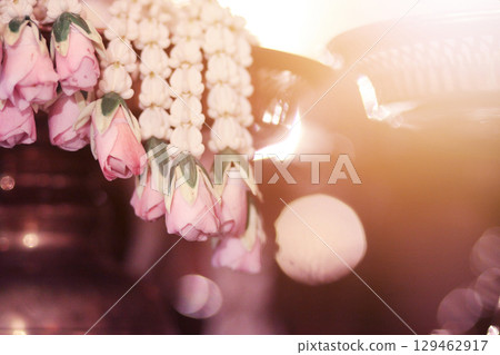 Flower garlands on a gold tray in tradition Thai wedding ceremony day. Jasmine garland Flower garlands on a gold tray in tradition Thai wedding ceremony day. Jasmine garland 129462917