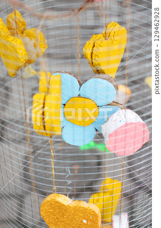 Yellow foam heart shapes hanging in Wire cage Decorate in wedding love garden. Valentines day concept. 129462928