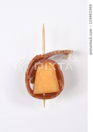 Cube of melon wrapped in prosciutto Cube of melon wrapped in prosciutto 129463364