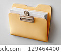 Open Yellow Folder With White Papers Stacked, Secured By Silver Clip In Studio On Gray Background 129464400