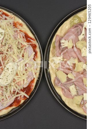 Unbaked pizzas 129465205