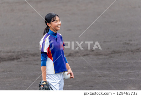 A junior high school girl pitching softball in a club activity A junior high school girl pitching softball in a club activity 129465732