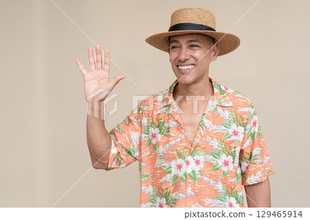 Tourist man greeting and waving hand Tourist man greeting and waving hand 129465914