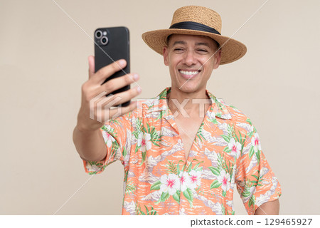 Smiling Hispanic Tourist Man Using Phone Taking Selfie Photo 129465927