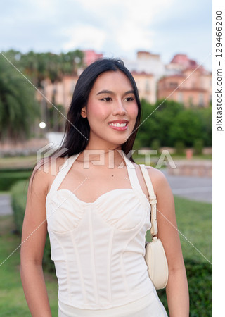 Young Asian woman tourist with long black hair in European style town in portrait travel style Young Asian woman tourist with long black hair in European style town in portrait travel style 129466200