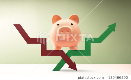 Piggy bank stands on intersecting red green arrows, reflecting the volatility of global markets, financial uncertainty, and impact of global economic shifts, trade wars and geopolitical conflicts 129466290