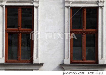 Two brown-framed windows on the facade. Two brown-framed windows on the facade. 129466441
