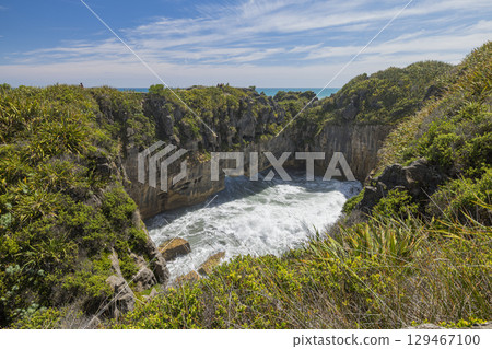 Pancake Rocks surge pools in Punakaiki on New Zealand's West Coast Pancake Rocks surge pools in Punakaiki on New Zealand's West Coast 129467100