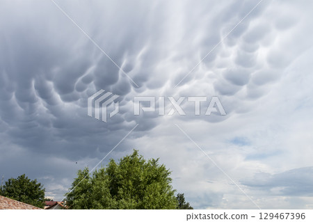 Mammatus, mamma, sky and clouds for backgrounds, outdoors, nebula, nimbus Mammatus, mamma, sky and clouds for backgrounds, outdoors, nebula, nimbus 129467396
