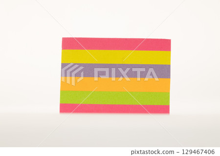Colorful sticky notes arranged in a stack, isolated on a clean white background 129467406