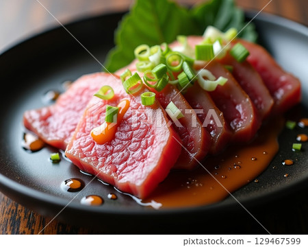 Close-up Delicious Seared Tuna Tataki with Fresh Spring Onion Garnish Food 129467599