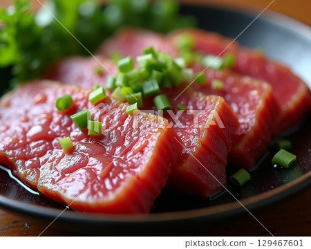 Delicious and Fresh Raw Beef Slices with Scallions on Plate Cuisine Delicious and Fresh Raw Beef Slices with Scallions on Plate Cuisine 129467601