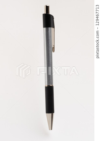 The pen features a polished silver clip and a pointed tip, suggesting readiness for writing 129467713