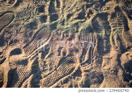 Footprints remaining on the beach Footprints remaining on the beach 129468740