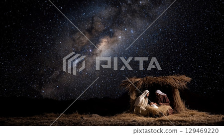 Mary, Joseph, and baby Jesus in a manger under the starry Bethlehem sky displaying faith and the essence of Christianity 129469220
