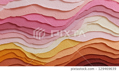 Textured layers of colorful paper in shades of pink, orange, and cream creating a vibrant visual landscape 129469639