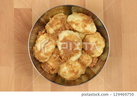 Potato dumplings topped with toasted breadcrumbs 129469750