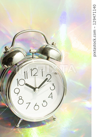 Alarm clock with a fantastic aurora background 129471140