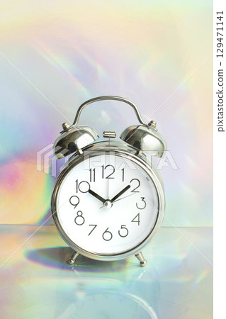 Alarm clock with a fantastic aurora background 129471141