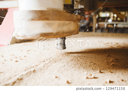Close-up shot of machine with numerical control cuts wood. Cnc tool. Close-up shot of machine with numerical control cuts wood. Cnc tool. 129471158