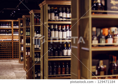Elegant Wine Shop Interior with Assorted Bottles Elegant Wine Shop Interior with Assorted Bottles 129471184