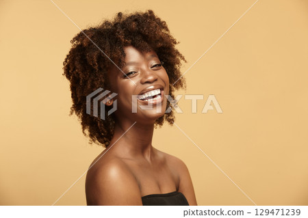 Headshot portrait of smiling girl with chocolate perfect skin Headshot portrait of smiling girl with chocolate perfect skin 129471239