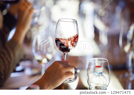 Person Holding Wine Glass With Red Wine Person Holding Wine Glass With Red Wine 129471475