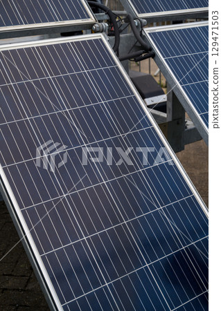 Closeup solar panels, sun energy system. Green energy Closeup solar panels, sun energy system. Green energy 129471503