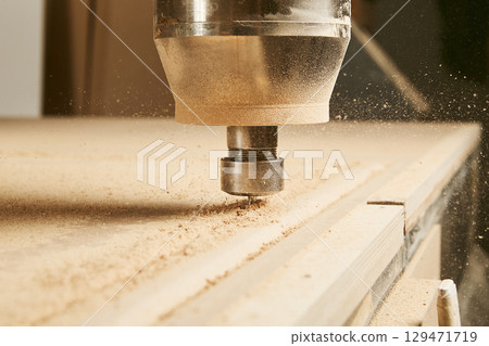 Cutting wood using a machine with numerical control. Cnc tool. Cutting wood using a machine with numerical control. Cnc tool. 129471719