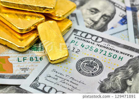 Paper us 100 dollar bill with gold bars, concept of investment and saving, wealth 129471891