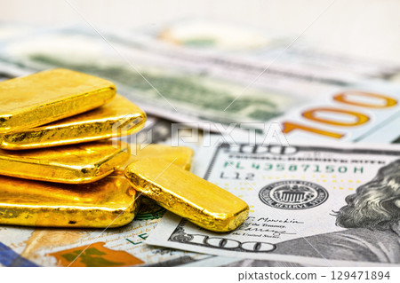 Paper us 100 dollar bill with gold bars, concept of investment and saving, wealth 129471894