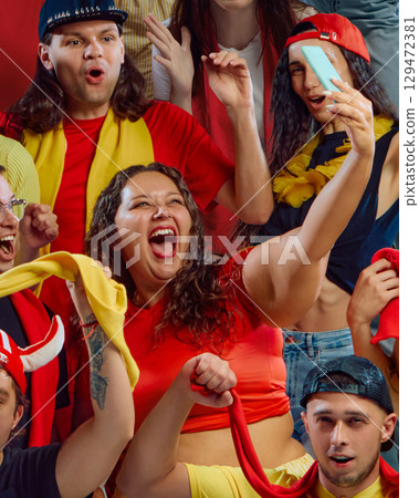 Female plus size football fan taking selfie at match. Female plus size football fan taking selfie at match. 129472381