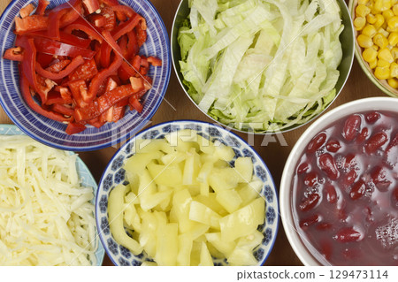 Assortment of fresh chopped vegetables and shredded chesse 129473114