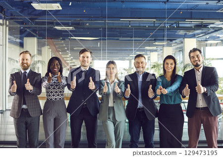 Group Portrait Of Business Team Showing Thumbs Up In Office 129473195