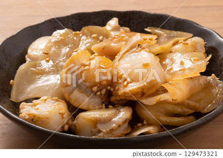 Scallops, pickled mustard greens, and soy sauce 129473321