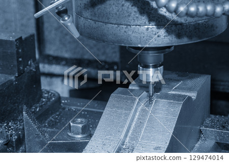 The CNC milling machine finish cut the mold parts by solid ball nose end mill tool in the blue tone. 129474014