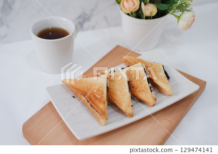 Toasted Chocolate Sandwich with Hot Tea 129474141