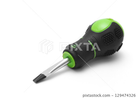 screwdriver with green handle on a white background.  129474326